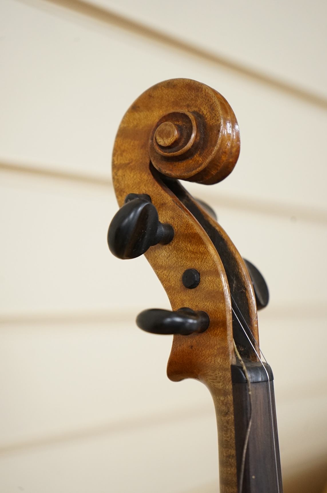 Four violins; a German Dresden violin, together with further two German violins, and a Saxony violin, three in cases or the remains of cases.